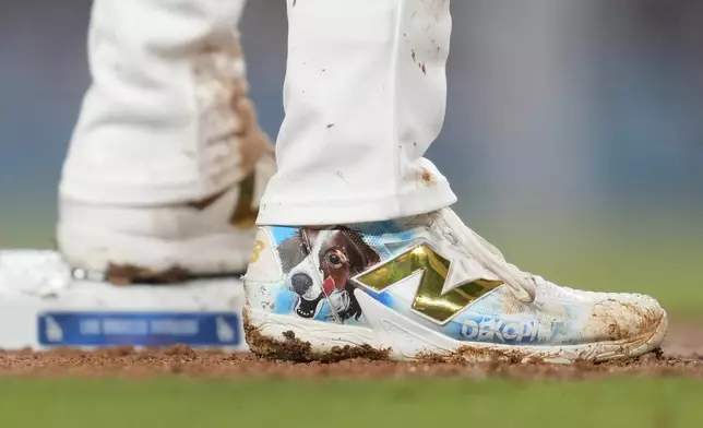 Los Angeles Dodgers designated hitter Shohei Ohtani (17) stands on third base during the second inning of a baseball game against the Chicago Cubs in Los Angeles, Wednesday, Sept. 11, 2024. (AP Photo/Ashley Landis)