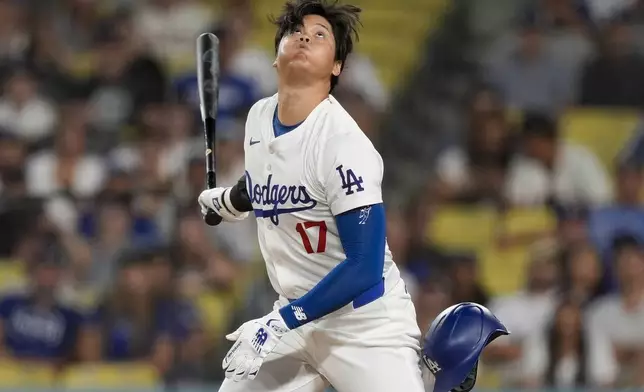 Los Angeles Dodgers designated hitter Shohei Ohtani reacts after a pitch during the eighth inning of a baseball game against the San Francisco Giants, Wednesday, July 24, 2024, in Los Angeles. (AP Photo/Ryan Sun)