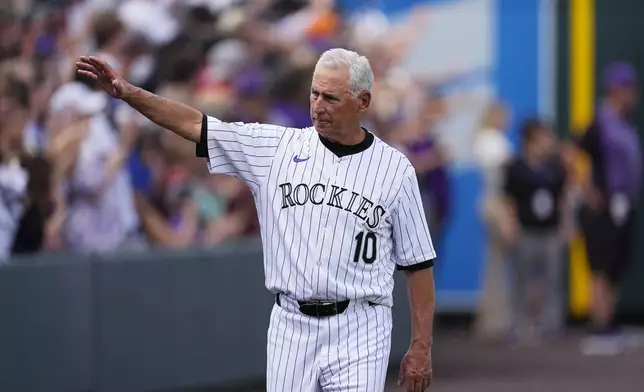 Colorado Rockies manager Bud Black waves during the team's ceremonial walk around the field to acknowledge fans following a loss in the team's season finale Sunday, Sept. 29, 2024, in Denver. (AP Photo/David Zalubowski)