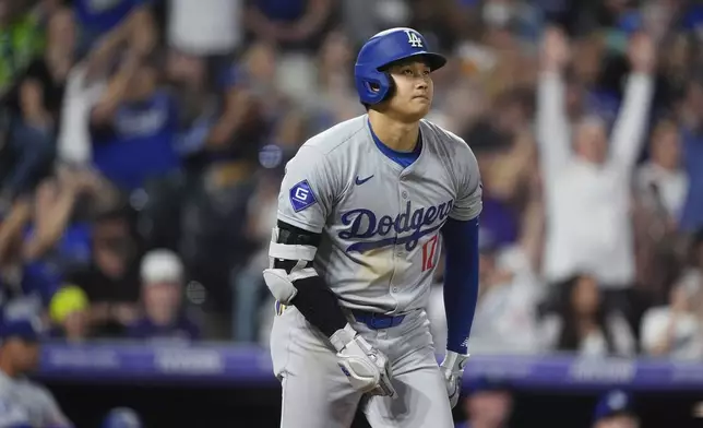 Los Angeles Dodgers' Shohei Ohtani heads up the first base line after hitting a three-run home run off Colorado Rockies relief pitcher Anthony Molina in the sixth inning of a baseball game Friday, Sept. 27, 2024, in Denver. (AP Photo/David Zalubowski)