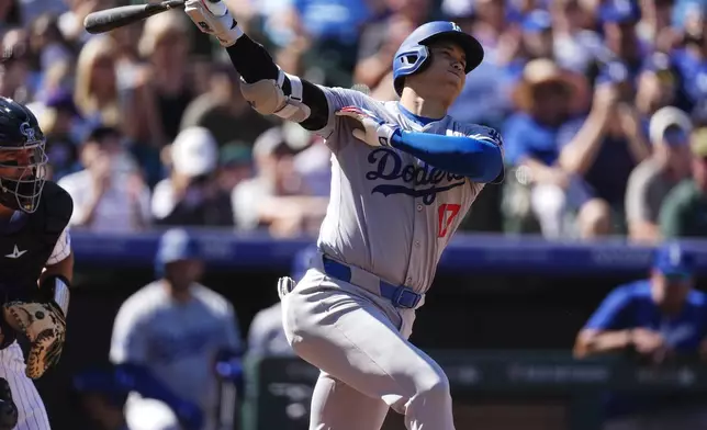 Los Angeles Dodgers' Shohei Ohtani grounds out against Colorado Rockies starting pitcher Ryan Feltner in the first inning of a baseball game Sunday, Sept. 29, 2024, in Denver. (AP Photo/David Zalubowski)