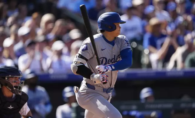 Los Angeles Dodgers' Shohei Ohtani grounds out against Colorado Rockies starting pitcher Ryan Feltner in the fourth inning of a baseball game Sunday, Sept. 29, 2024, in Denver. (AP Photo/David Zalubowski)