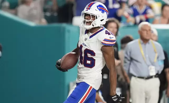 Buffalo Bills cornerback Ja'Marcus Ingram (46) reacts after scoring a touchdown after intercepting a pass during the second half of an NFL football game against the Miami Dolphins, Thursday, Sept. 12, 2024, in Miami Gardens, Fla. (AP Photo/Rebecca Blackwell)