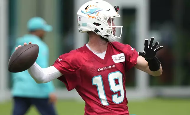Miami Dolphins quarterback Skylar Thompson (19) throws a pass during practice at the NFL football team's training facility, Wednesday, Sept. 18, 2024, in Miami Gardens, Fla. (AP Photo/Lynne Sladky)