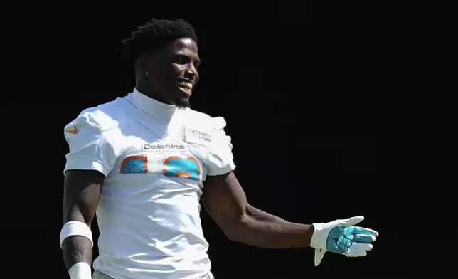 Miami Dolphins wide receiver Tyreek Hill walks on the field during a team practice session, Wednesday, Sept. 11, 2024, in Miami Gardens, Fla.(AP Photo/Rebecca Blackwell)