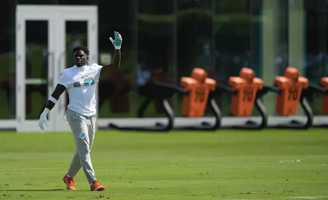 Miami Dolphins wide receiver Tyreek Hill walks on the field during a team practice session, Wednesday, Sept. 11, 2024, in Miami Gardens, Fla.(AP Photo/Rebecca Blackwell)