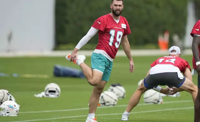 Miami Dolphins quarterback Skylar Thompson (19) stretches during practice at the NFL football team's training facility, Wednesday, Sept. 18, 2024, in Miami Gardens, Fla. (AP Photo/Lynne Sladky)