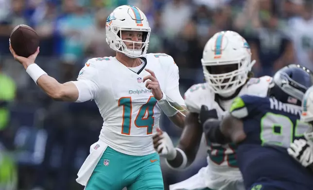 Miami Dolphins quarterback Tim Boyle (14) throws during the second half of an NFL football game against the Seattle Seahawks, Sunday, Sept. 22, 2024, in Seattle. (AP Photo/Stephen Brashear)