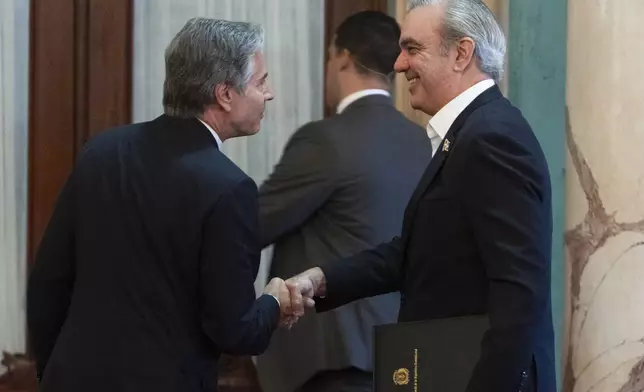 U.S. Secretary of State Antony Blinken, left, and Dominican Republic President Luis Abinader shake hands after giving a joint news conference at the National Palace in Santo Domingo, Sept. 6, 2024. (Roberto Schmidt/Pool photo via AP)