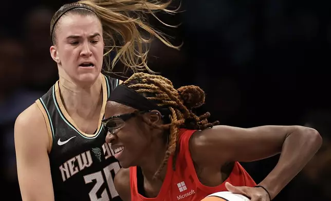 Atlanta Dream guard Allisha Gray drives past New York Liberty guard Sabrina Ionescu (20) during the first half of first-round WNBA basketball playoff game, Tuesday, Sept. 24, 2024, in New York. (AP Photo/Adam Hunger)