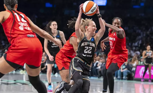 New York Liberty guard Courtney Vandersloot (22) drives to the basket during the first half of a WNBA basketball first-round playoff game against the Atlanta Dream, Sunday, Sept. 22, 2024, in New York. (AP Photo/Corey Sipkin)