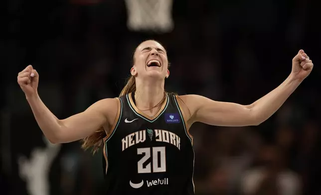 New York Liberty guard Sabrina Ionescu reacts during the second half of a first-round WNBA basketball playoff game against the Atlanta Dream, Tuesday, Sept. 24, 2024, in New York. The Liberty won 91-82 to clinch the series 2-0. (AP Photo/Adam Hunger)