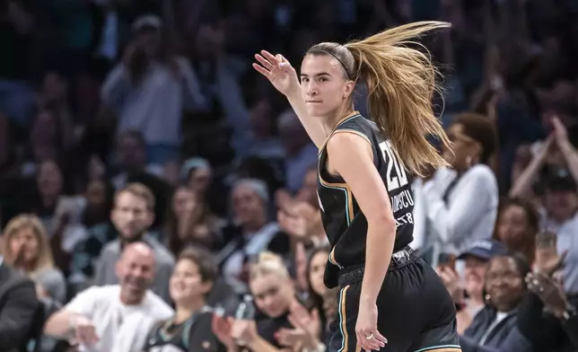 New York Liberty guard Sabrina Ionescu (20) celebrates after a 3-point basket during the first half of a WNBA basketball first-round playoff game against the Atlanta Dream, Sunday, Sept. 22, 2024, in New York. (AP Photo/Corey Sipkin)