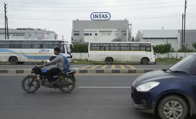 Commuters drive past the INTAS pharmaceutical plant in Ahmedabad, India, Friday, Aug. 2, 2024, where U.S. Food and Drug Administration inspectors documented a “cascade of failure” during a 2022 safety inspection. (AP Photo/Ajit Solanki)