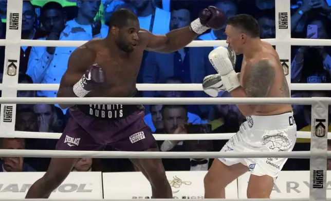 FILE - Britain's Daniel Dubois, left, and Ukraine's Oleksandr Usyk during their world heavyweight title fight at Tarczynski Arena in Wroclaw, Poland, Saturday, Aug. 26, 2023. (AP Photo/Czarek Sokolowski, file)