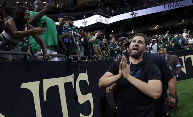 Philadelphia Eagles head coach Nick Sirianni leaves the field after a win over the New Orleans Saints in an NFL football game in New Orleans, Sunday, Sept. 22, 2024. (AP Photo/Butch Dill)