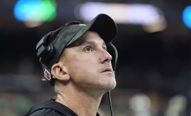 New Orleans Saints head coach Dennis Allen looks at the scoreboard in the second half of an NFL football game against the Philadelphia Eagles in New Orleans, Sunday, Sept. 22, 2024. (AP Photo/Gerald Herbert)