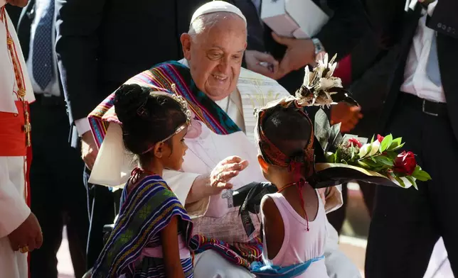 Pope Francis arrives at the 'Irmas ALMA' (Sisters of the Association of Lay Missionaries) School for Children with Disabilities in Dili, East Timor, Tuesday, Sept. 10, 2024. Pope Francis has indirectly acknowledged the abuse scandal in East Timor involving its Nobel Peace Prize-winning independence hero Bishop Carlos Filipe Ximenes Belo. "Let us also not forget that these children and adolescents have their dignity violated," Francis said. "In response, we are all called to do everything possible to prevent every kind of abuse and guarantee a healthy and peaceful childhood for all young people." (AP Photo/Gregorio Borgia)