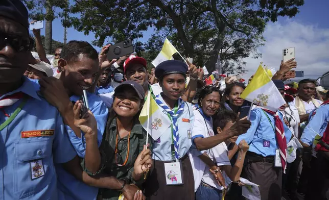 East Timorese gather to see Pope Francis in Dili, East Timor, Monday, Sept. 9, 2024. (AP Photo/Firdia Lisnawati)