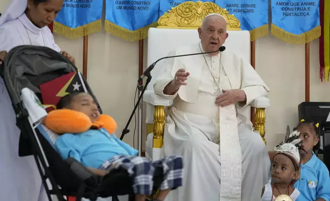 Pope Francis speaks during a visit at the 'Irmas ALMA' (Sisters of the Association of Lay Missionaries) School for Children with Disabilities in Dili, East Timor, Tuesday, Sept. 10, 2024. Pope Francis has indirectly acknowledged the abuse scandal in East Timor involving its Nobel Peace Prize-winning independence hero Bishop Carlos Filipe Ximenes Belo. (AP Photo/Gregorio Borgia)