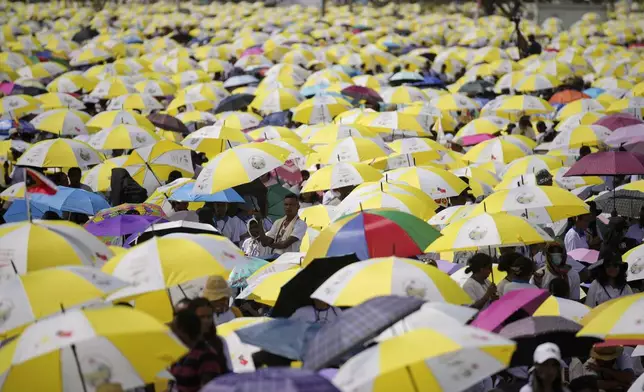 East Timorese crowd Tacitolu park for Pope Francis' Mass in Dili, East Timor, Tuesday, Sept. 10, 2024. (AP Photo/Dita Alangkara)