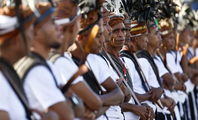 Guards in traditional attire stand to welcome Pope Francis during a ceremony at the Presidential Palace in Dili, East Timor, Sept.9, 2024. (Willy Kurniawan/Pool Photo via AP)