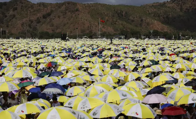 Catholic faithful gather for a Holy Mass with Pope Francis at the Esplanade of Taci Tolu in Dili, East Timor, Tuesday, Sept.10, 2024. (Willy Kurniawan/Pool Photo via AP)