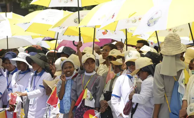 Nuns wait Pope Francis' arrival outside of the Dili Presidente Nicolau Lobato International Airport in Dili, East Timor, Monday, Sept. 9, 2024. (AP Photo/Firdia Lisnawati)