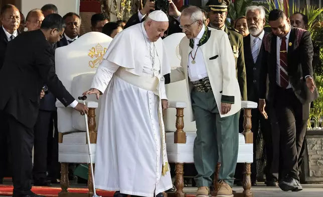 Pope Francis and East Timor's President Jose Ramos-Horta, right, arrive for a welcoming ceremony at the Presidential Palace in Dili, East Timor, Monday Sept. 9, 2024. (Yasuyoshi Chiba/Pool Photo via AP)