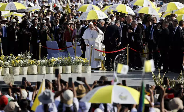 Pope Francis greets faithful on the day of the Holy Mass at the Esplanade of Taci Tolu during his apostolic trip to Asia, in Dili, East Timor, Tuesday, Sept. 10, 2024. (Willy Kurniawan/Pool Photo via AP)