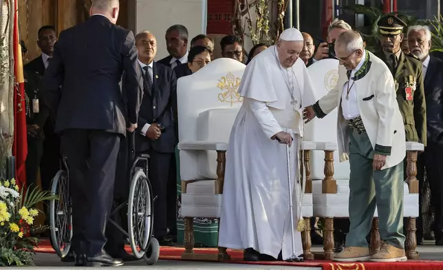 Pope Francis and East Timor's President Jose Ramos-Horta, right, arrive for a welcoming ceremony at the Presidential Palace in Dili, East Timor, Monday Sept. 9, 2024. (Yasuyoshi Chiba/Pool Photo via AP)