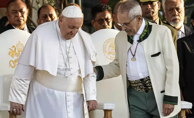 Pope Francis and East Timor's President Jose Ramos-Horta, right, arrive for a welcoming ceremony at the Presidential Palace in Dili, East Timor, Monday Sept. 9, 2024. (Yasuyoshi Chiba/Pool Photo via AP)