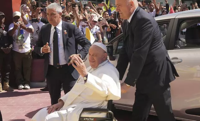 Pope Francis greets before the meeting with young people in Centro de Convencoes in Dili, East Timor, Wednesday, Sept. 11, 2024. (AP Photo/Firdia Lisnawati)