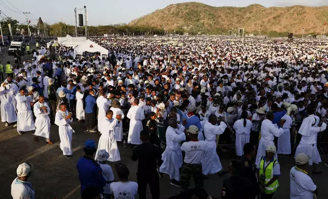 Faithful gather at the Esplanade of Taci Tolu during Pope Francis' apostolic trip to Asia, in Dili, East Timor, Tuesday, Sept. 10, 2024. (Willy Kurniawan/Pool Photo via AP)