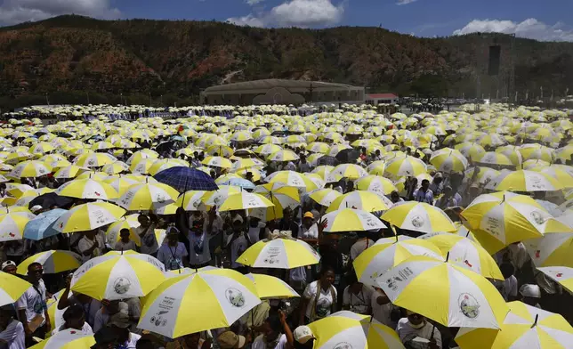 Catholic faithful gather for a Holy Mass with Pope Francis at the Esplanade of Taci Tolu in Dili, East Timor, Tuesday, Sept.10, 2024. (Willy Kurniawan/Pool Photo via AP)