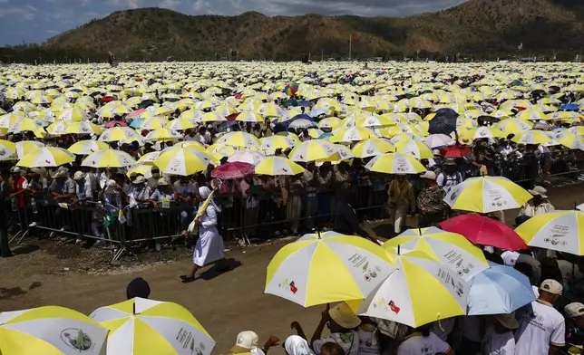 Catholic faithful gather for a Holy Mass with Pope Francis at the Esplanade of Taci Tolu in Dili, East Timor, Tuesday, Sept.10, 2024. (Willy Kurniawan/Pool Photo via AP)