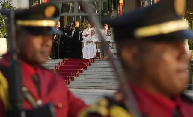 Pope Francis and East Timor's President José Manuel Ramos-Horta, right, attend a welcome ceremony outside the Presidential Palace in Dili, East Timor, Monday, Sept. 9, 2024. Pope Francis arrived in East Timor on Monday to encourage its recovery from a bloody and traumatic past and celebrate its development after two decades of independence from Indonesian rule. (AP Photo/Gregorio Borgia)