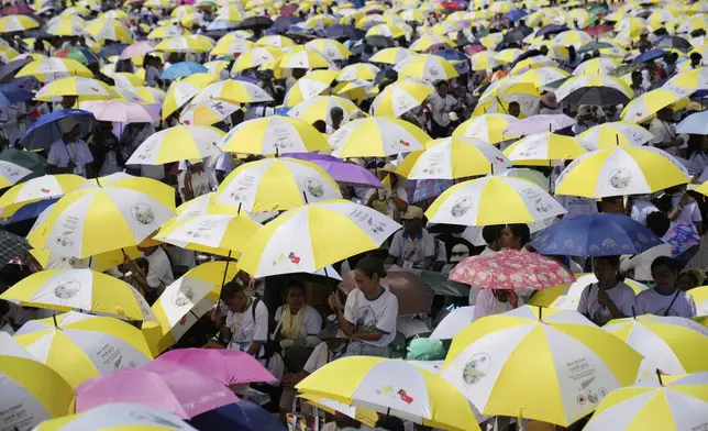 East Timorese crowd Tacitolu park for Pope Francis' Mass in Dili, East Timor, Tuesday, Sept. 10, 2024. (AP Photo/Dita Alangkara)