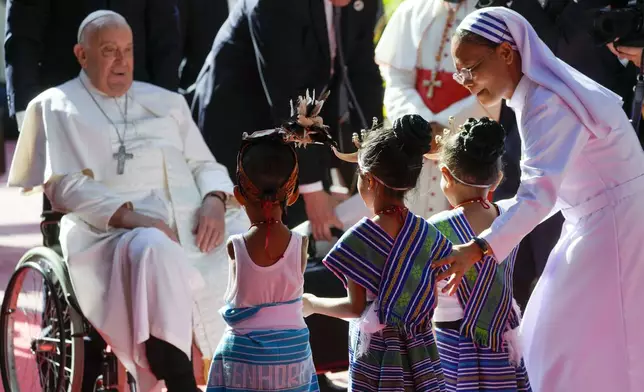 Pope Francis arrives at the 'Irmas ALMA' (Sisters of the Association of Lay Missionaries) School for Children with Disabilities in Dili, East Timor, Tuesday, Sept. 10, 2024. Pope Francis has indirectly acknowledged the abuse scandal in East Timor involving its Nobel Peace Prize-winning independence hero Bishop Carlos Filipe Ximenes Belo. "Let us also not forget that these children and adolescents have their dignity violated," Francis said. "In response, we are all called to do everything possible to prevent every kind of abuse and guarantee a healthy and peaceful childhood for all young people." (AP Photo/Gregorio Borgia)