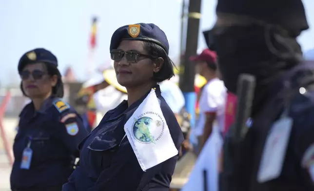 Security stand guard to welcome Pope Francis' visit in Dili, East Timor Monday, Sept. 9, 2024. (AP Photo/Firdia Lisnawati)