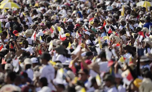 People attend the holy mass lead by Pope Francis at Tacitolu park in Dili, East Timor, Tuesday, Sept. 10, 2024. (AP Photo/Dita Alangkara, Pool)