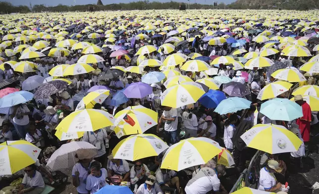 East Timorese crowd Tacitolu park for Pope Francis' Mass in Dili, East Timor, Tuesday, Sept. 10, 2024. (AP Photo/Dita Alangkara)