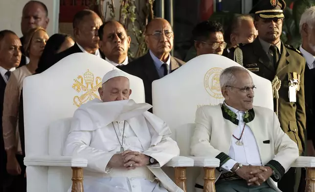 Pope Francis and East Timor's President Jose Ramos-Horta, right, arrive for a welcoming ceremony at the Presidential Palace in Dili, East Timor, Monday Sept. 9, 2024. (Yasuyoshi Chiba/Pool Photo via AP)