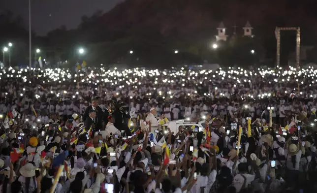 Pope Francis leaves after leading a holy mass at Tasitolu park in Dili, East Timor, Tuesday, Sept. 10, 2024. (AP Photo/Dita Alangkara, Pool)