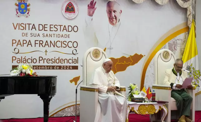 Pope Francis listens to East Timor's President José Manuel Ramos-Horta, right, during a meeting with East Timor's authorities, civil society and the diplomatic corps in the Presidential Palace Hall Salao China in Dili, East Timor, Monday, Sept. 9, 2024. Pope Francis arrived in East Timor on Monday to encourage its recovery from a bloody and traumatic past and celebrate its development after two decades of independence from Indonesian rule. (AP Photo/Gregorio Borgia)