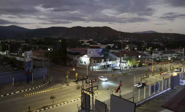 A street light is seen during a sunrise in Dili, East Timor Sunday, Sept. 8, 2024. (AP Photo/Firdia Lisnawati)