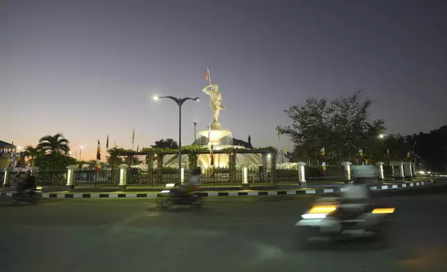 Streetlights are seen at sunset in Dili, East Timor Sunday, Sept. 8, 2024. (AP Photo/Firdia Lisnawati)