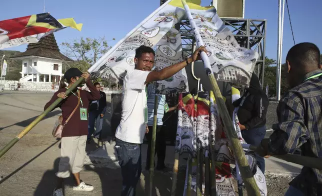 Volunteers prepare to welcome Pope Francis in Dili, East Timor Tuesday, Sept. 3, 2024. (AP Photo/Firdia Lisnawati)