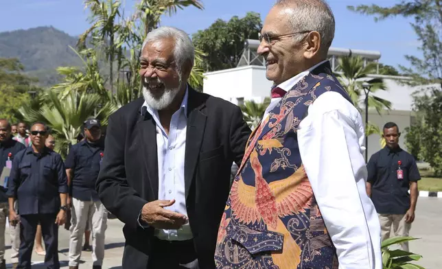 East Timor's President Jose Ramos Horta, right, and Prime Minister Xanana Gusmao share a laugh during a ceremony at the Presidential palace in Dili, East Timor on Thursday, Sept. 5, 2024. (AP Photo/Firdia Lisnawati)