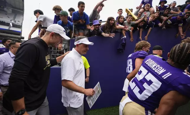 Washington head coach Jedd Fisch walks into the tunnel after a 30-9 victory over Eastern Michigan in an NCAA college football game Saturday, Sept. 7, 2024, in Seattle. (AP Photo/Lindsey Wasson)